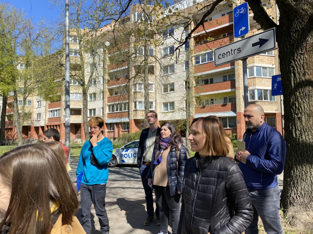 The group visiting the surroundings of the market guided by the local partners